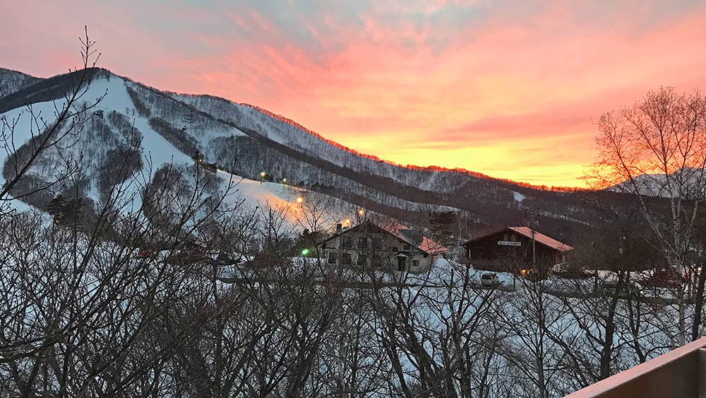 sunset from kuma lodge on a great day of spring skiing in madarao